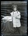 Mystery girl with racket, c. 1915 (4293519990).jpg