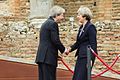 G7 Taormina Paolo Gentiloni Theresa May handshake 2017-05-26.jpg